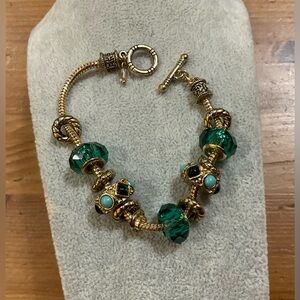Gold plated/toned bohemian style toggle bracelet with 5 round charms about 7 1/2